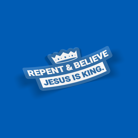 Mockup of crown-shaped “Repent & Believe – Jesus Is King” sticker, white-on-clear vinyl decal displayed on blue background for product showcase.
